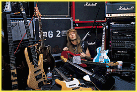 Robert surrounded by basses and guitars!