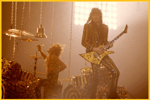 Robert playing drums and Michael playing guitar in the yellow & black striped days.